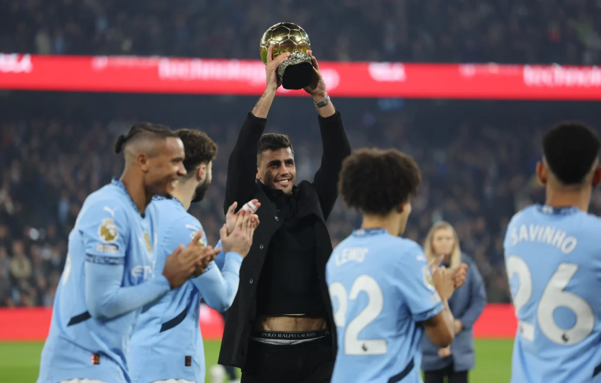 Manchester City has included injured midfielder Rodri in their Champions League knockout phase squad, signaling optimism about his potential return this season. The Spanish international, who suffered an ACL tear against Arsenal on September 22, has targeted an April comeback, coinciding with the Champions League quarterfinals which begin April 8. In meeting UEFA's Thursday midnight deadline for updated squad lists, City made strategic choices within the three-player limit for midseason transfers. The club opted to exclude recent Palmeiras signing Vitor Reis, while incorporating new arrivals Nico Gonzalez, Omar Marmoush, and Abdukodir Khusanov. The inclusion of Rodri, who scored the winning goal in the 2023 final against Inter Milan, comes as City faces a challenging path in the competition. Their immediate hurdle is a two-leg knockout playoff against Real Madrid, scheduled for next Tuesday and February 19. The victor will advance to face either Atletico Madrid or Bayer Leverkusen in the round of 16. Pep Guardiola, speaking to reporters on Friday, maintained his focus on immediate challenges, particularly City's FA Cup match against Leyton Orient. "After the game [at Orient] we will come back early to Manchester and after we have time to start to talk [about Real Madrid]," he stated, emphasizing his commitment to treating each competition with equal importance. The City manager expressed particular enthusiasm about the addition of Nico Gonzalez, viewing the 23-year-old as crucial cover for Rodri's position. "It's a position where we were weak after the absence from Rodri," Guardiola noted, adding, "I know him from the Barcelona academy and his father was working here. I'm really pleased from the effort of the club to bring him here for the next years."